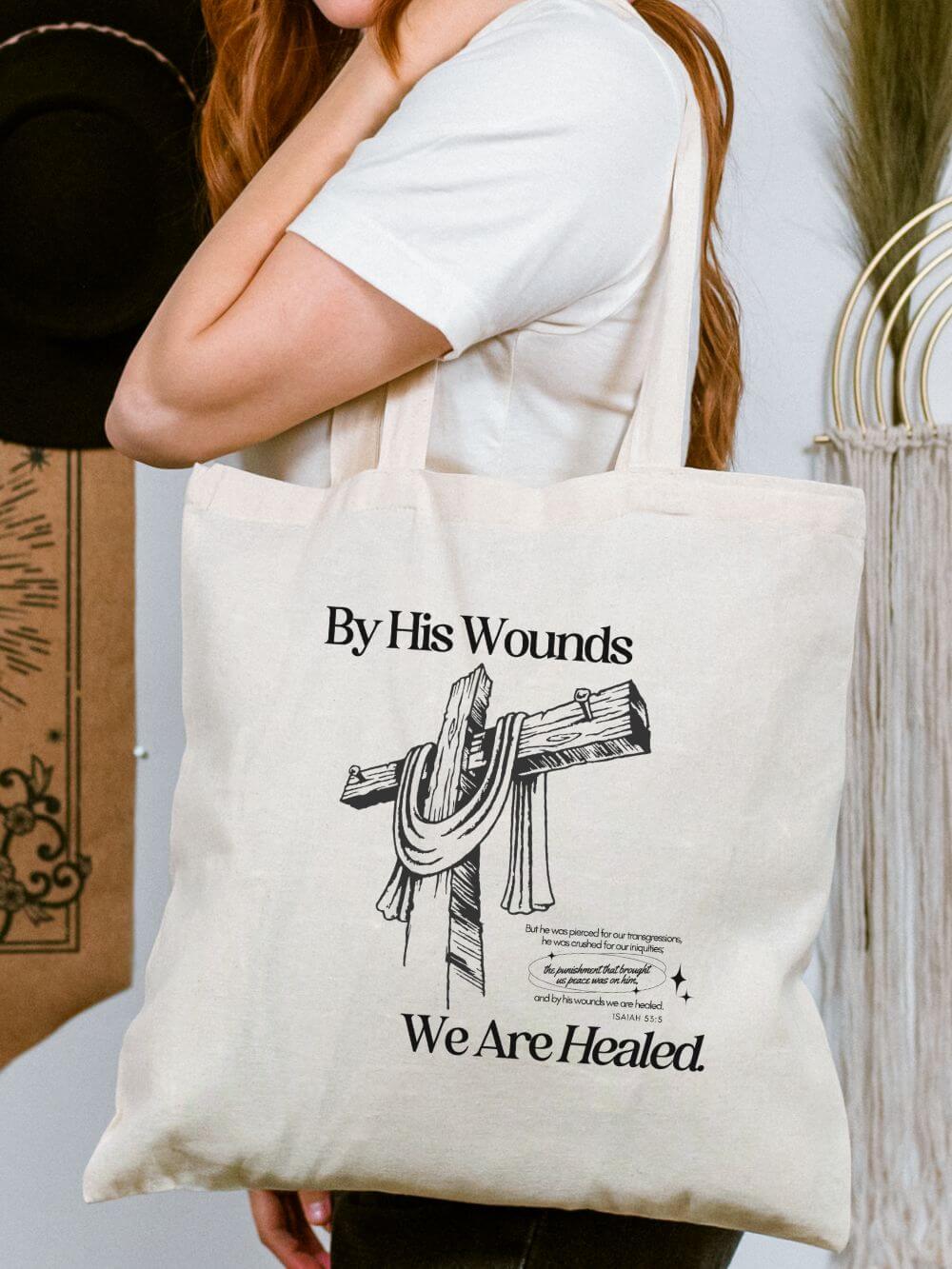By_His_Wounds_Tote By His Wounds We Are Healed Christian Cross Cotton Canvas Tote Bag - Image 1