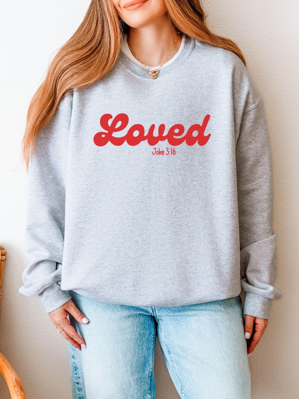 Loved_John_3_16_Ash Loved John 3:16 Retro Script Christian Pullover Heavy Blend Women's Cozy Crewneck Sweatshirt - Image 1