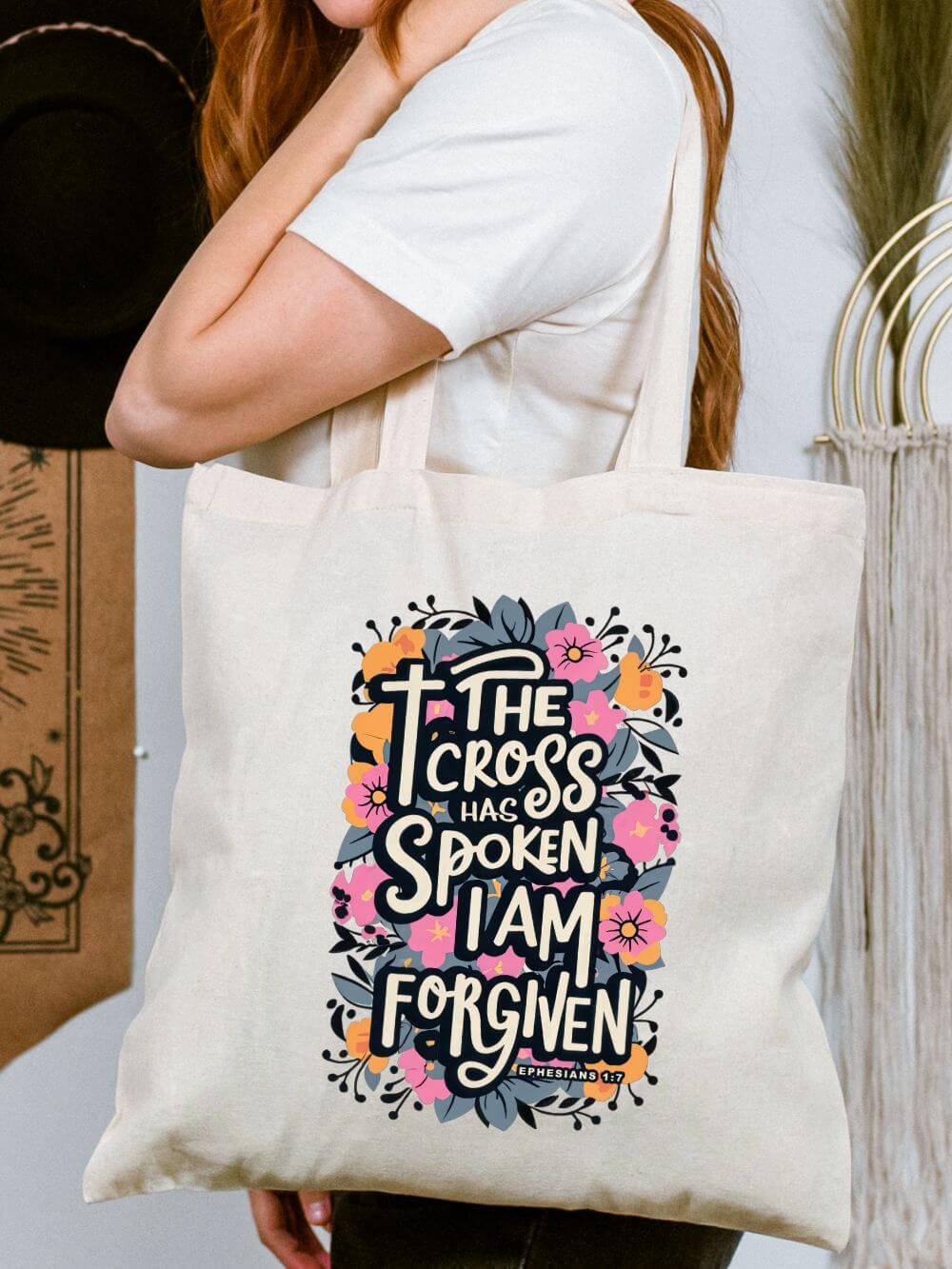The_Cross_has_Spoken_Tote The Cross Has Spoken I Am Forgiven Cotton Canvas Floral Christian Tote Bag - Image 1